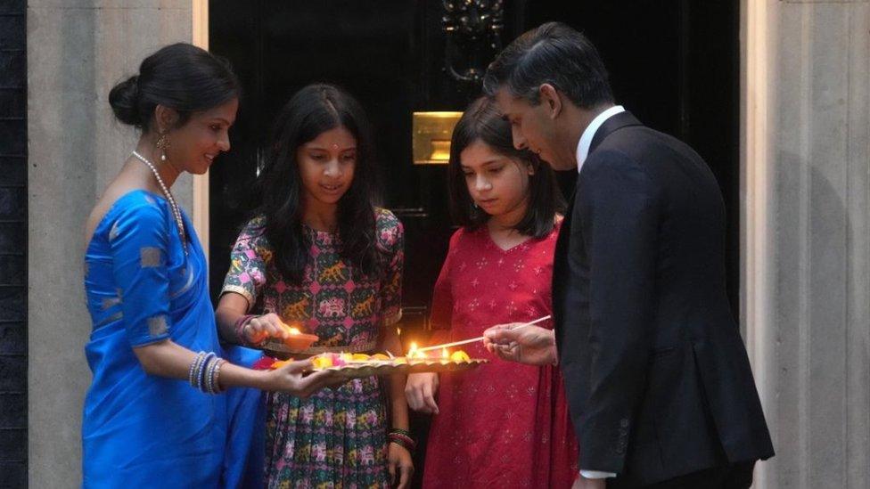 Rishi Sunak and his wife Akshata Murty with their daughters marking Diwali by lighting the Diyas candle