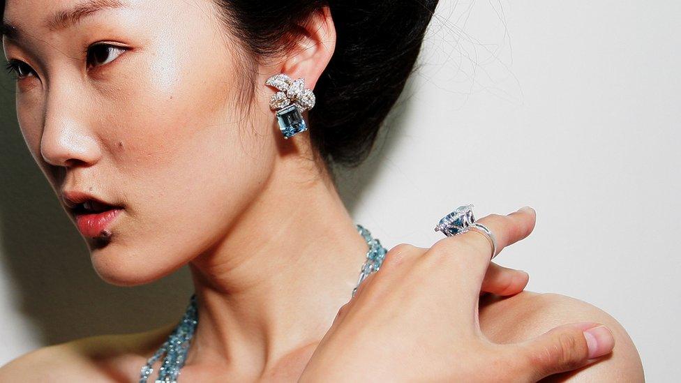 A model poses backstage ahead of the Tiffany and Co. show during Audi Fashion Festival Singapore 2011 at Tent@Orchard on May 16, 2011 in Singapore.