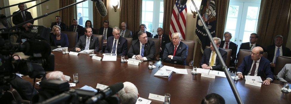 US President Donald Trump, centre, hosts a cabinet meeting in the Cabinet Room of the White House