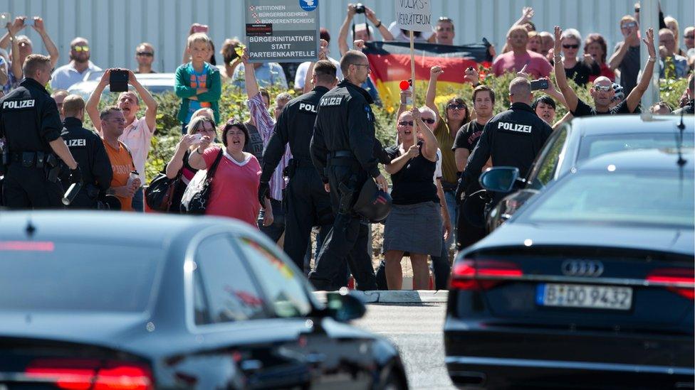 On 26 Aug a crowd in Heidenau hostile to migrants jeered Chancellor Merkel