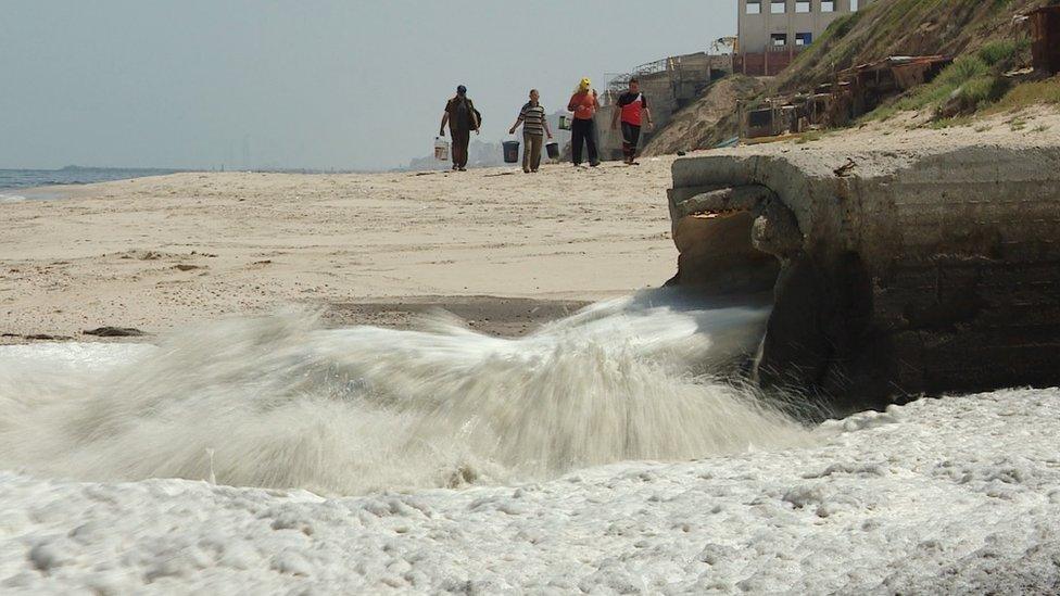 Sewage runs into the Mediterranean Sea on the coast of Gaza