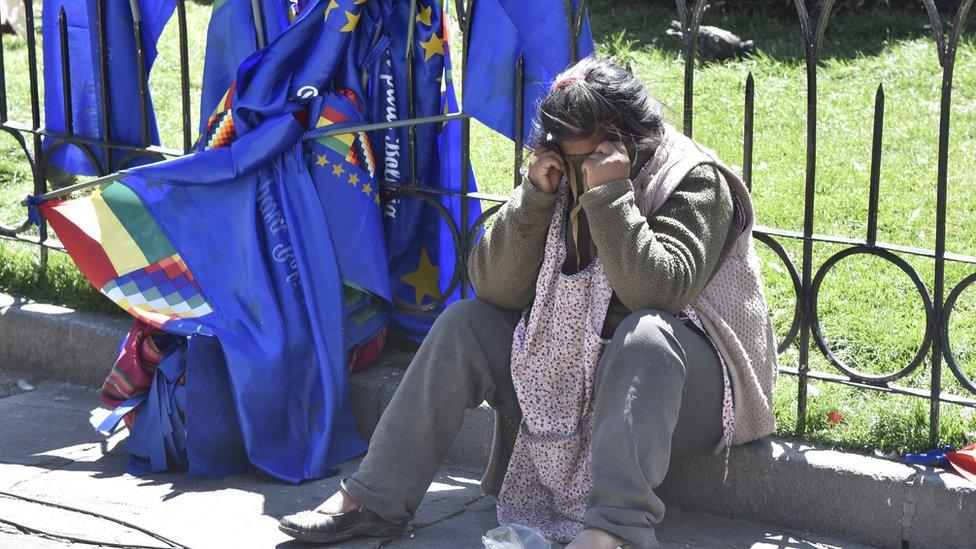 A woman reacts in dejection after the decision of the International Court of Justice regarding Bolivia's maritime claim against Chile in La Paz on October 1, 2018.