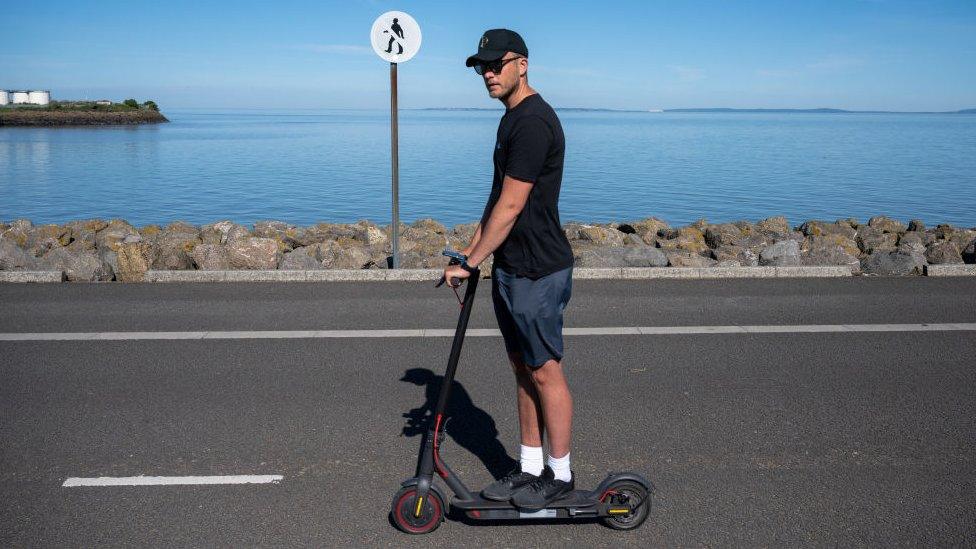 man on scooter