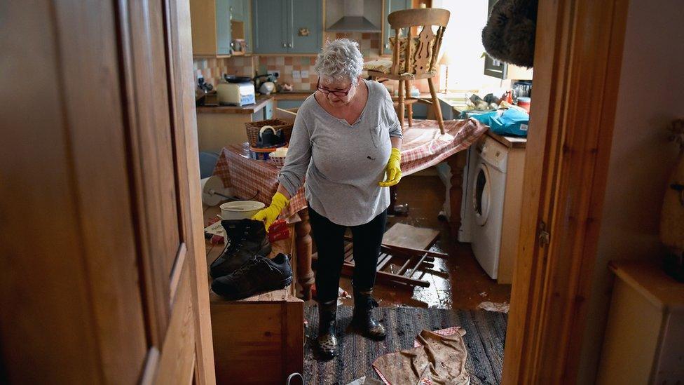 Woman inside flooded home in Carlisle