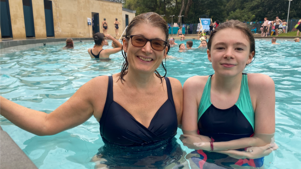 A mother and daughter in a pool