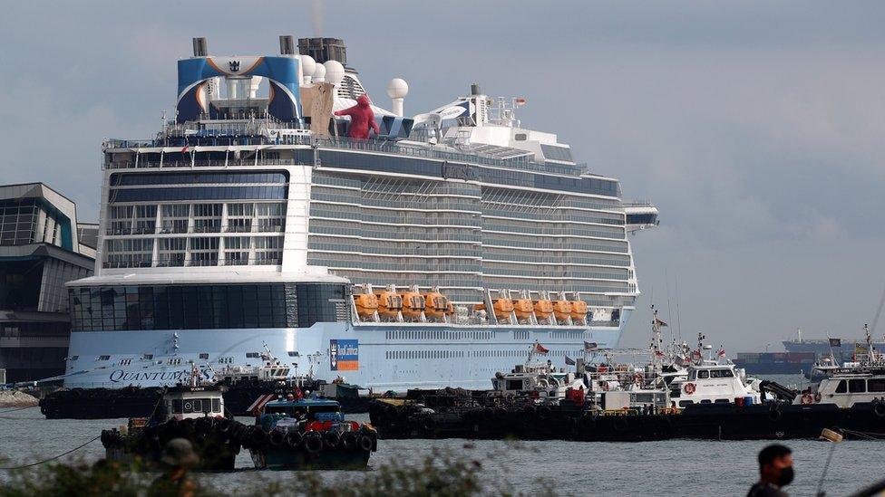 Royal Caribbean"s Quantum of the Seas cruise ship is moored at Marina Bay Cruise Center after a passenger tested positive for coronavirus disease (COVID-19) during a cruise to nowhere, in Singapore, December 9, 2020.