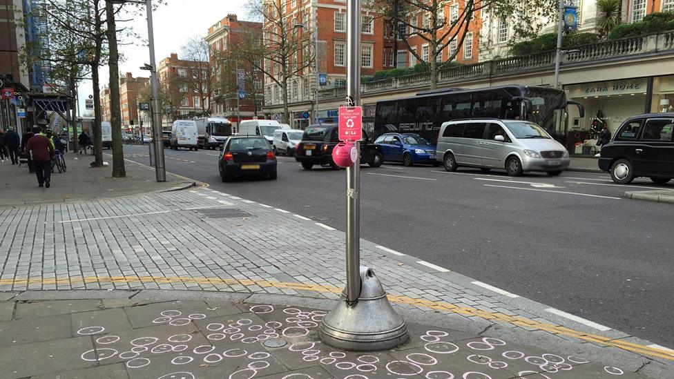 A Gumdrop bin on a street