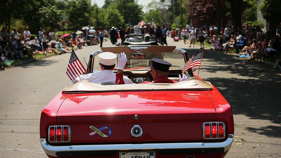 car with American flags