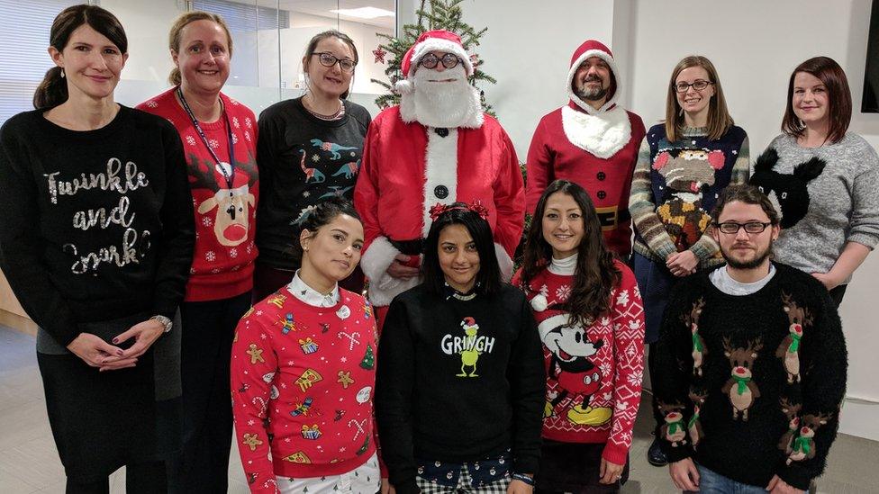 A group photo of Royal College of Speech & Language Therapists staff wearing Christmas jumpers