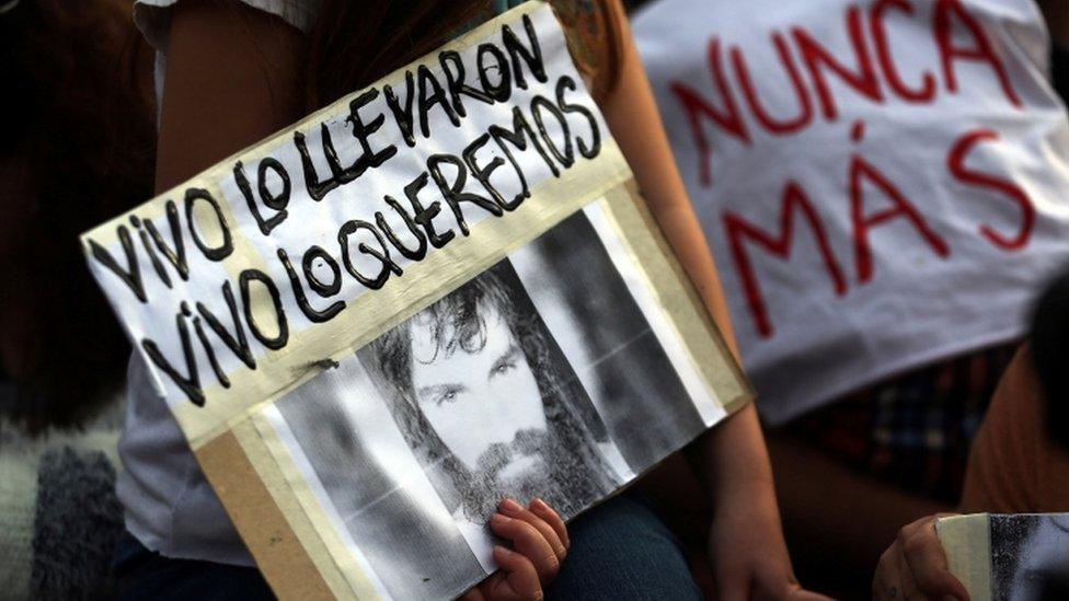 A girl holds a portrait of Santiago Maldonado, a protester who has been missing since security forces clashed with indigenous activists in Patagonia one month ago, during a demonstration to demand actions to find him in Buenos Aires, Argentina September 1, 2017