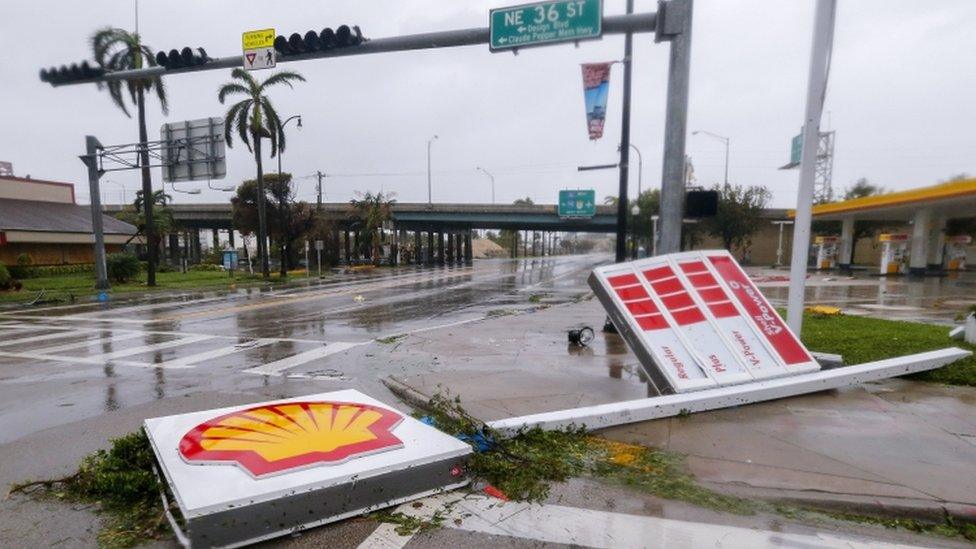 A fallen gas station sign along Biscayne Boulevard after the full effects of Hurricane Irma struck in Miami, Florida, USA