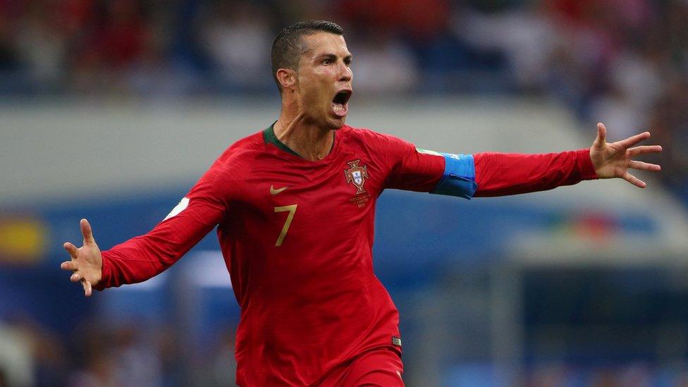 Portugal"s Cristiano Ronaldo celebrates scoring their third goal against Spain