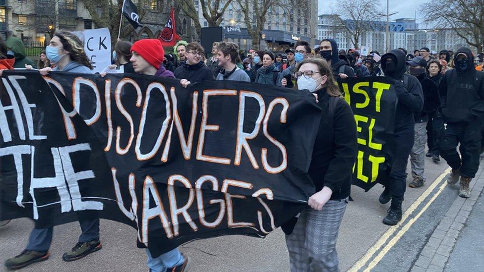 Protesters walk through Bristol