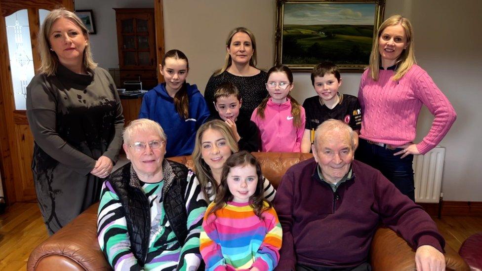 Pat Kelly (pictured in the front row on the right) with his wife, children and grandchildren