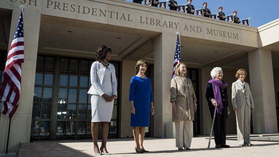 US first lady Michelle Obama, stands with former first ladies Laura Bush, Hillary Clinton, Barbara Bush and Rosalynn Carter as they arrive for a dedication ceremony at the George W. Bush Library and Museum on the grounds of Southern Methodist University April 25, 2013