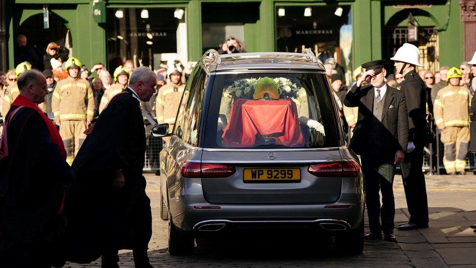 The coffin in a hearse