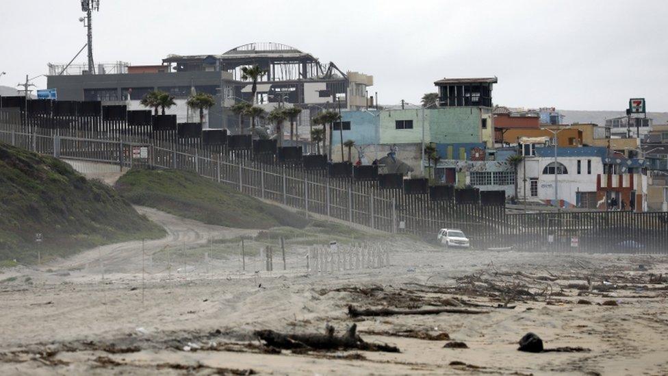 US border patrol watch the 'Friendship Fence' which is already in place near the US city of San Diego