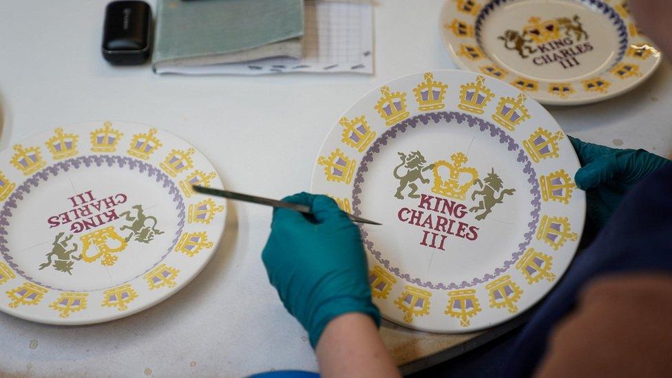 King Charles III themed mugs on display during the production of hand-decorated pieces from the forthcoming Coronation collection, at the Emma Bridgewater Pottery Factory in Stoke on Trent.