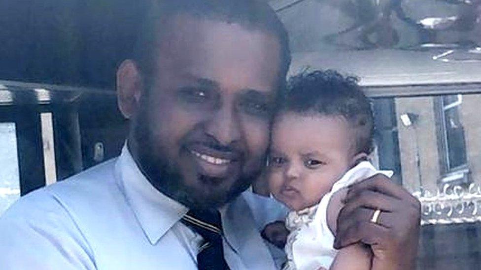 Undated handout photo issued by Bishara Maye of her husband bus driver Nadir Nur with his 10-month-old daughter, Sahra Nadir. Nur died in the UK after testing positive for coronavirus