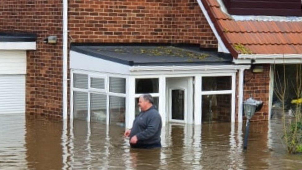 Steve McCarthy waist-deep in water