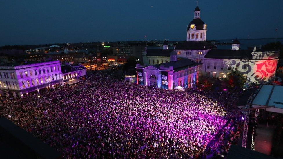 crowds pack out a square in Kingston, Ontario, on 20 August 2016