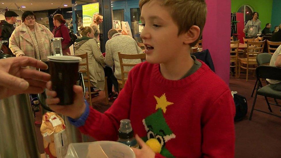 Boy gets drink at emergency centre