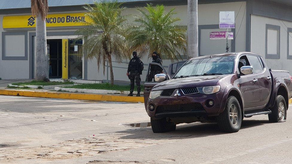 Police outside bank after shoot out with robbers in Milagres. 7 Dec 2018