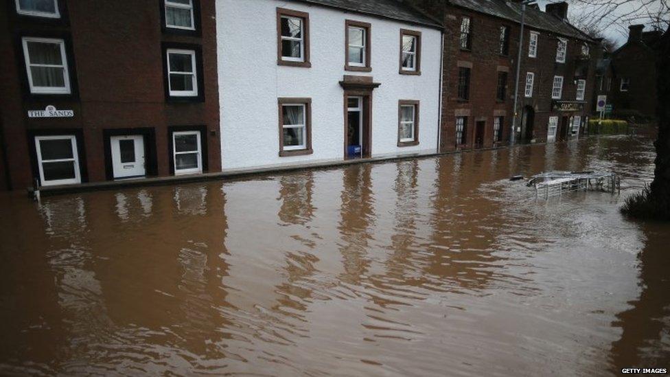 Flooded street in Cumbria last December