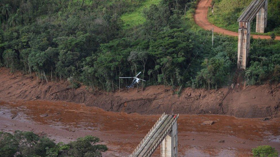 Aerial view taken after the collapse of a dam which belonged to Brazil's giant mining company Vale