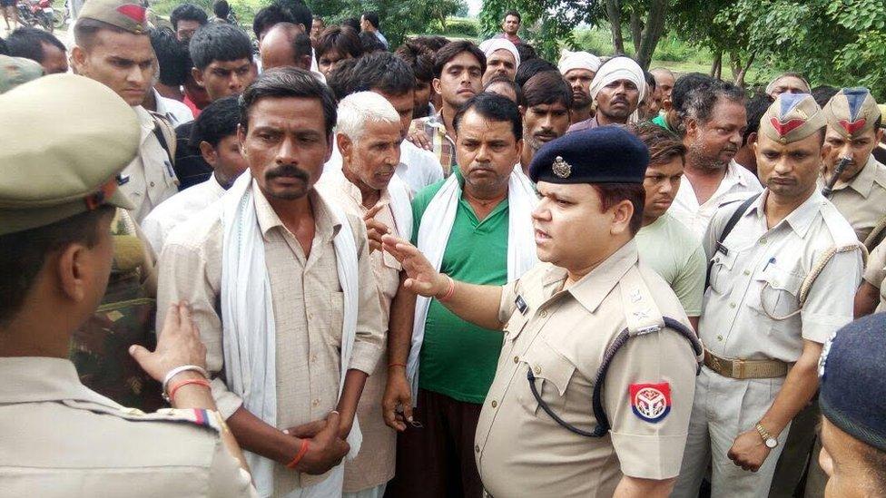 Police at the site of the murder