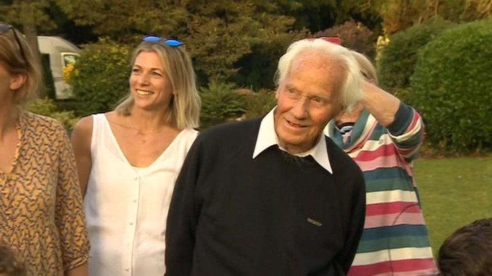 RAF veteran Eric Downs watching Spitfire flypast