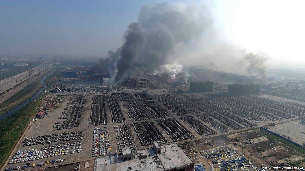 In this photo released by China"s Xinhua News Agency, smoke rise from the site of explosions from a nearby building in the Binhai New Area in northeastern China"s Tianjin municipality, Thursday, Aug. 13, 2015.