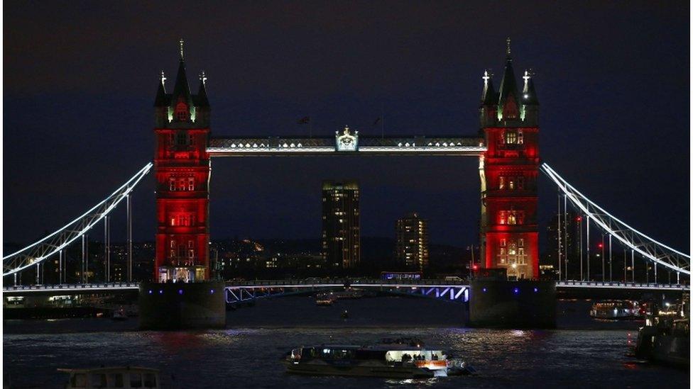 London's Tower Bridge is illuminated in blue, white and red lights