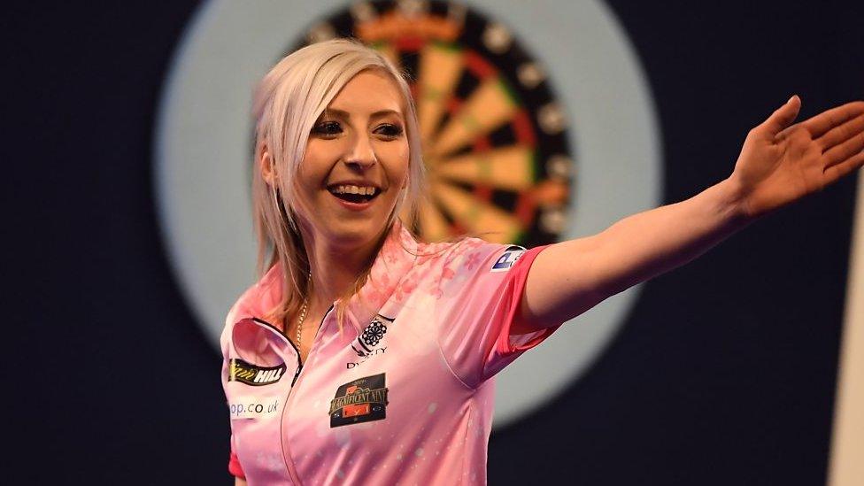 Fallon Sherrock reacts to becoming the first woman to win a match at the PDC World Championships.