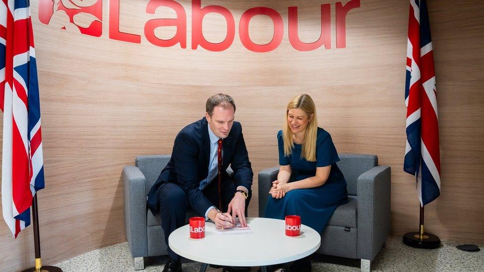 Dan Poulter signs his Labour membership form after defecting from the Conservative party