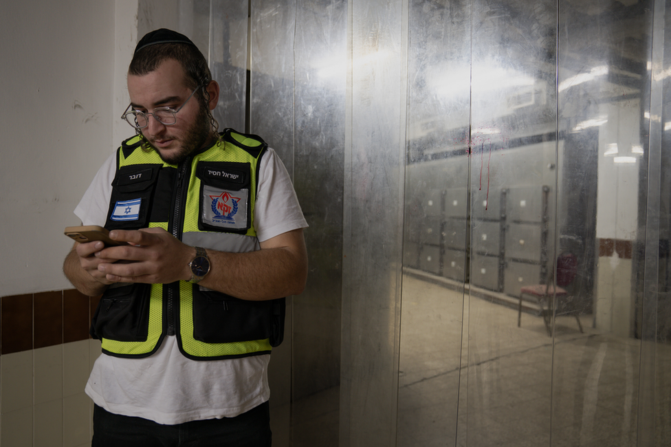 Zaka volunteer Israel Hasid awaits the arrival of hundreds of bodies at a morgue in Tel Aviv.