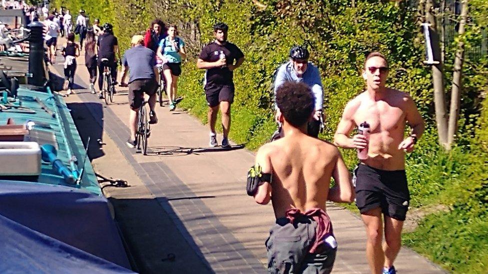 People using the canal path in Hackney last weekend. Boat owners moored on Regent's Canal, near Victoria Park, Hackney, said hundreds of people had swamped the towpath at the weekend, breaching social distancing rules.