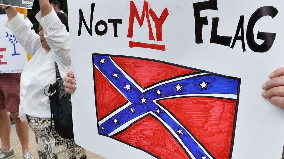 A sign held up during a protest rally against the Confederate battle flag in South Carolina, USA