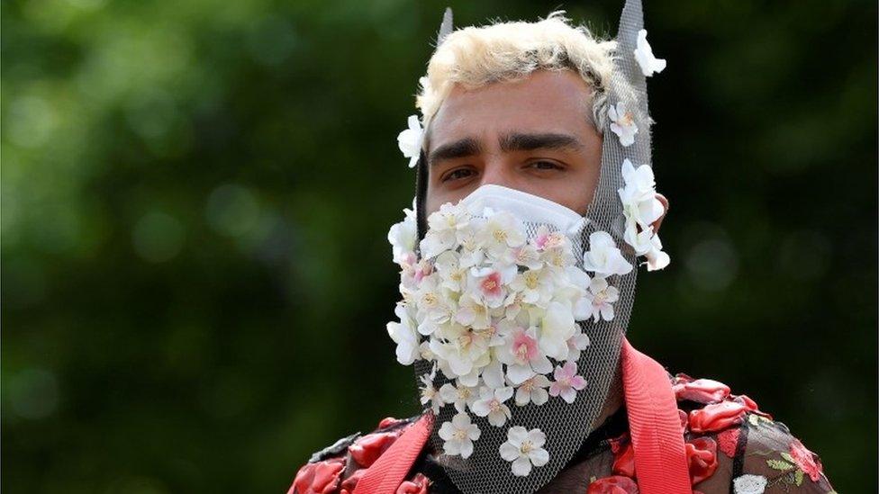 A participant dons a flower decorated face mask at the Black Trans Lives Matter rally in London