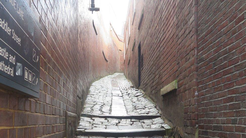 A view up a narrow alleyway