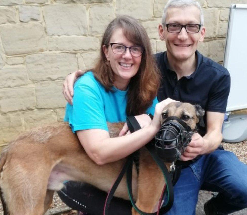 Gary with couple who adopted him