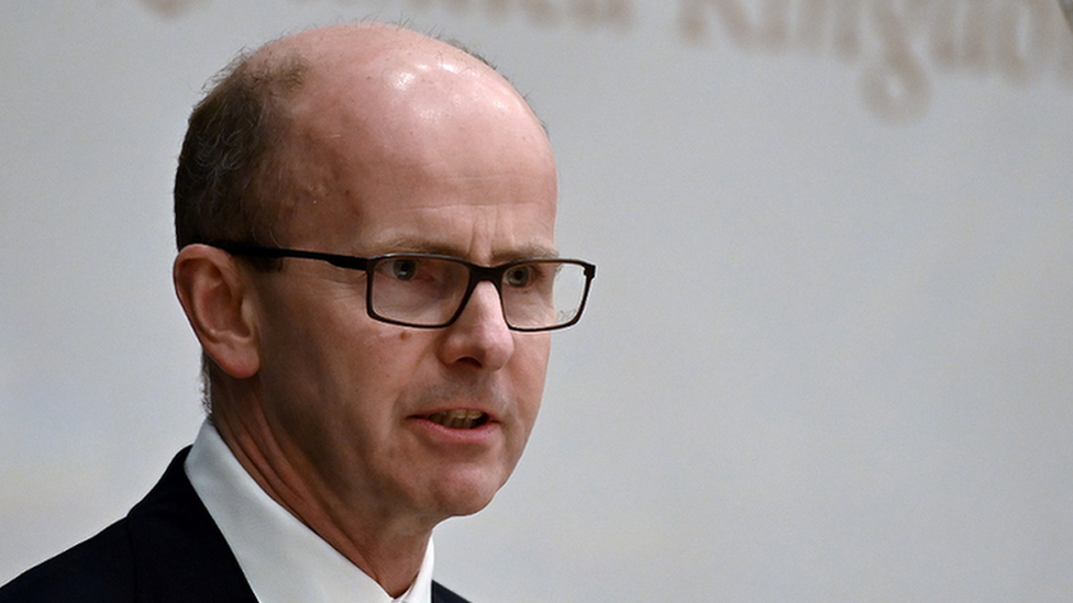 Sir Jeremy Fleming delivering an address in Singapore in 2019