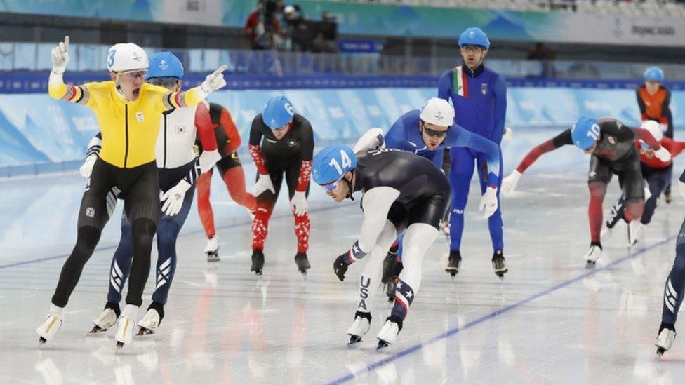 Belgian speed skater Bart Swings celebrates winning gold in men's mass start event