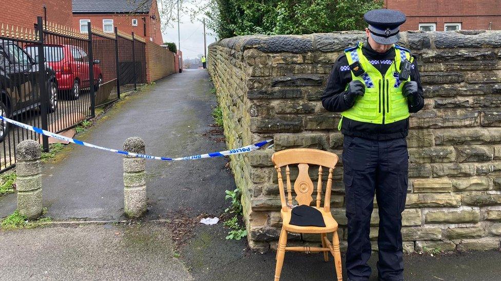 Police officer and cordon