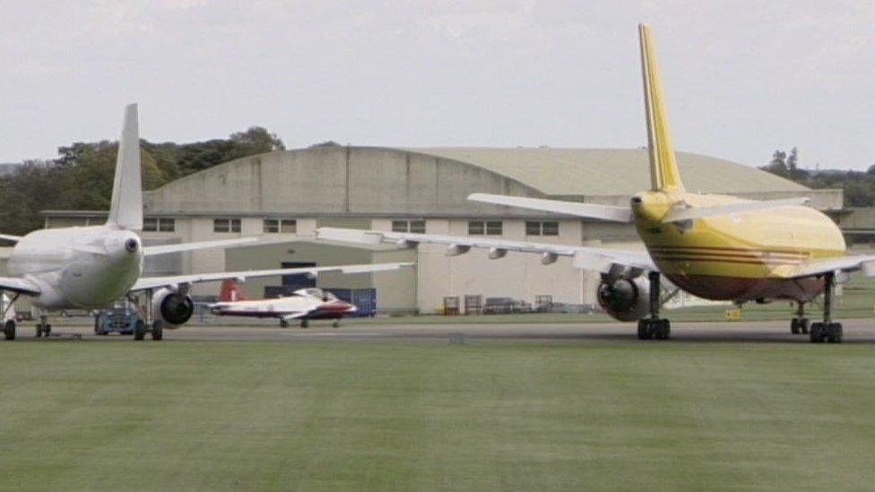 Planes in front of a hanger at Cotswold Airport