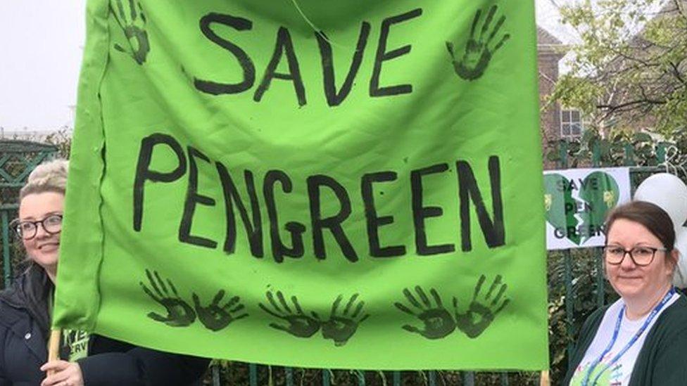 Pen Green nursery protest, parents and people holding a banner