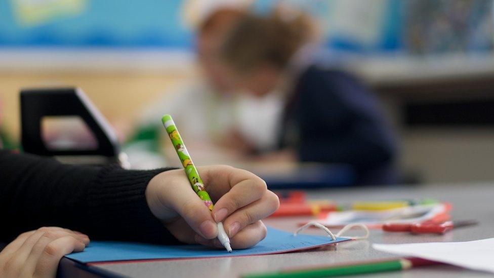 school pupil writing