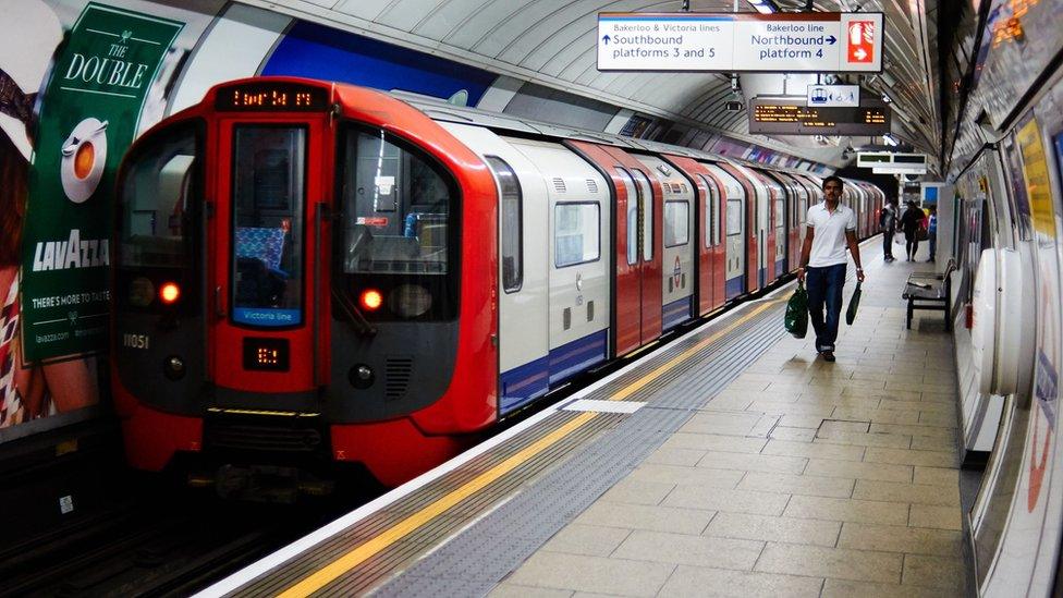 Tube train pulling into station