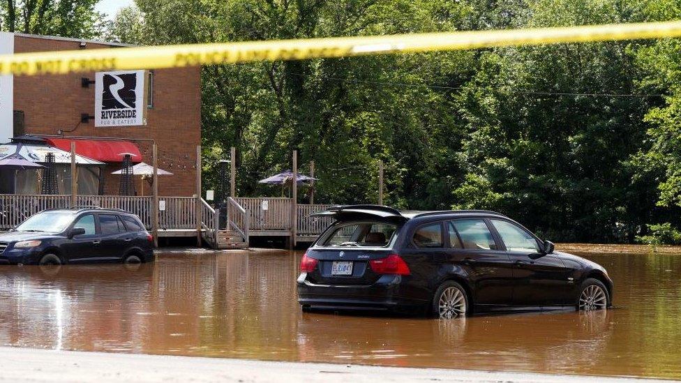 Vehicles partially submerged are seen after the heaviest rain to hit the Atlantic Canadian province of Nova Scotia in more than 50 years triggered floods, in Bedford, Halifax, Nova Scotia, Canada July 23, 2023. REUTERS/John Morris