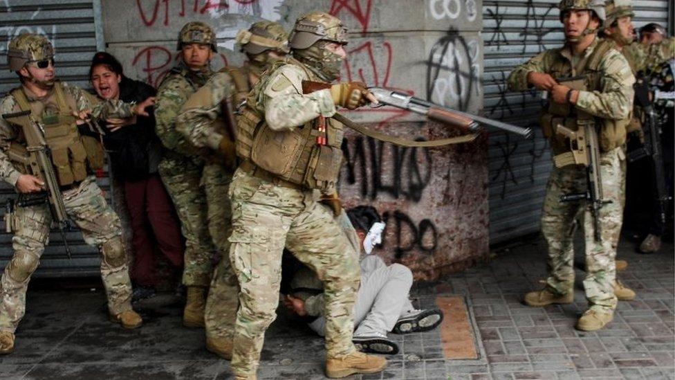 Security forces detain a demonstrator during anti-government protests, in Concepcion, Chile October 26, 2019.